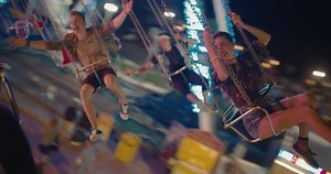 clip-29344936-happy-teenage-best-friends-riding-chairoplane-carousel