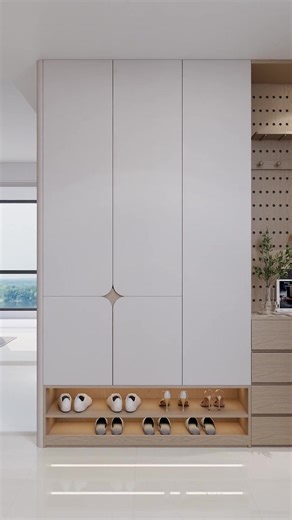 Sleek lines, warm wood, and a place for everything 🤍👟✨ #vrishtidesigns #modernhome #smartstorage #foyerinspo #minimalstyle #interiorinspo | Vrishti Designs