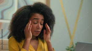 African American woman female businesswoman unwell tired frustrated ethnic business girl office worker typing laptop feel bad health suffer migraine pain overworked hurt ache headache tension stress