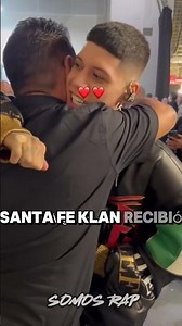 Santa Fe Klan greets their father with a kiss on the cheek