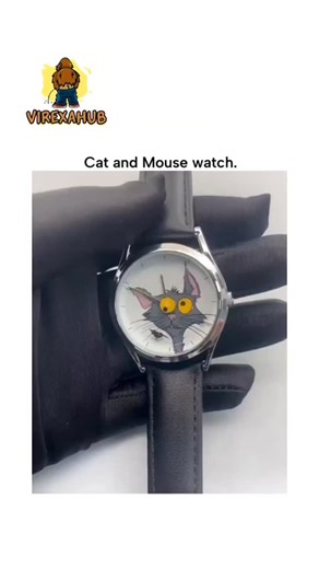VIREXAHUB on Instagram: "The post showcases a novelty quartz wristwatch featuring an animated cat chasing a mouse around the dial to mark seconds, a playful nod to the "cat and mouse" idiom popularized in folklore and cartoons like Tom and Jerry. Designed by Belgian artist Kaat Deceuninck in collaboration with Mr. Jones Watches under the name "Mispoes!", it exemplifies how functional items can become art pieces, fitting the poster's theme of embedding creativity in everyday objects. With 15,000+