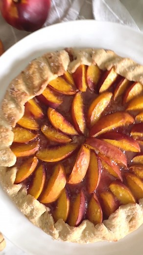 ✨Rustic Peach Galette✨Here is the perfect summer dessert for those of you that love pie (who doesn't, really?!?) but find the whole process of pie-making a little overwhelming. This rustic crostata (or galette) has the same flaky and buttery crust, just slightly crunchy and sugary at the edges, and the sweet and fruity filling exploding with drip-down-your-chin juicy peaches. And if you are anything like me, you will want to eat your slice right off the oven with a big scoop of vanilla ice-cream