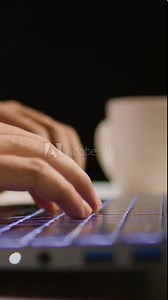 Vertical video Extreme close up shot of businessman using laptop keyboard and touchpad at office desk to send emails. Company executive typing on digital device, composing paperwork documents