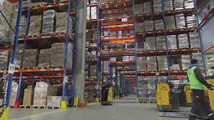 Large warehouse with goods. Very large warehouse with high shelves. Inside a large warehouse. Modern warehouse