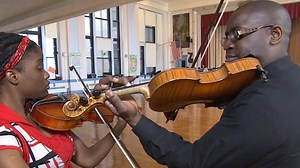 Violin player uses music to help community