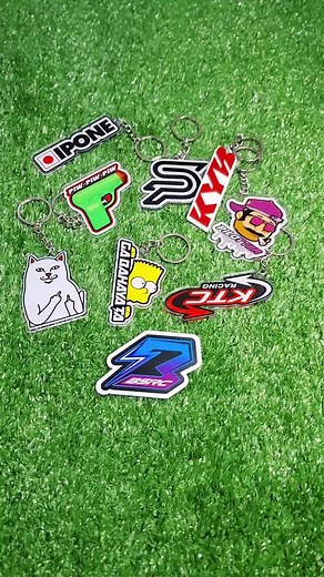 Beautifully Designed Keychains Displayed on Green Texture