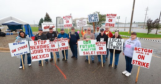 What is the 'two-tiered wage system' fueling worker strikes?