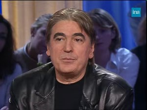 57K views · 692 reactions | SERGE LAMA. En 2001, Serge Lama sort son album "Feuille à feuille", l'occasion pour lui de revenir sur le début de sa carrière et ses talents de parolier. Il évoque son père et le malheur du couple parental, la scène du Grand Rex, les accidents et les amours qui l'ont marqué. | INA | Facebook