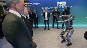 Putin welcomed by dancing robot, announces plan to build 38 new nuclear power units