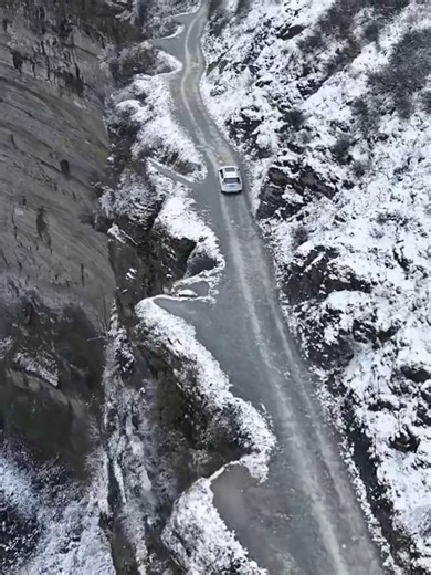 Exhilarating cliff road drive Watch out! This serpentine cliff road provides a #thrilling #driving experience as well as amazing vistas of frost-kissed valleys in #Chongqing. #ThrillingExperience | WE ARE CHINA