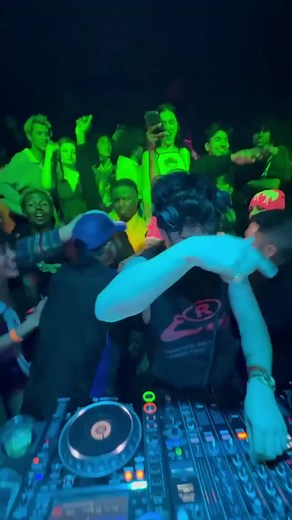 Energetic DJ Performance at Nightclub - Live Music Experience