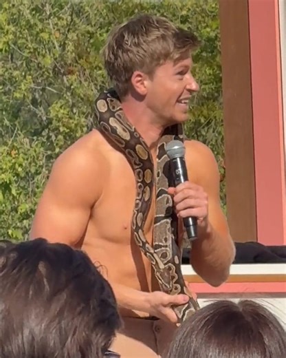 Entertainment Weekly on Instagram: "Rylee Arnold got up close and personal with Robert Irwin's python at #DWTS announcement event. 🐍"