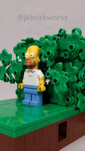 JK Brickworks - Jason Allemann on Instagram: "A small mechanical model of Homer emerging from, and backing into, the bushes. Instructions and full kit are available on @rebrickable and @buildamoc (links in bio). Designed in collaboration with Dustin Lebel, a fellow @parlugment member. When he brought his original to a meeting a few months ago, I was blown away with his novel approach for separating the leaves. The result is a nice compact model, making a great little desktop display. #jkbrickwor