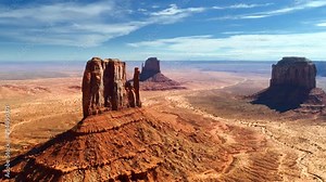 Monument Valley Navajo Tribal Park. A unique geological formation located in northeast Arizona and southeast Utah, which attracts lots of tourists. Aerial panoramic footage, 4K.