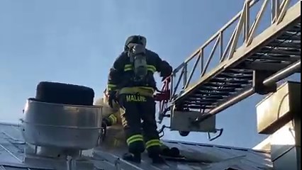 In this video, Gainesville firefighter Joe Bogowith and Caulfield firefighter Robert Malone work to cut a vent into the roof at Dawt Mill suring a Sept. 7 fire. Firefighters were able to extinguish the blaze with the structure still standing, but there was extensive damage to the kitchen and other damage theoughout the interior of the structure. | Ozark County Times