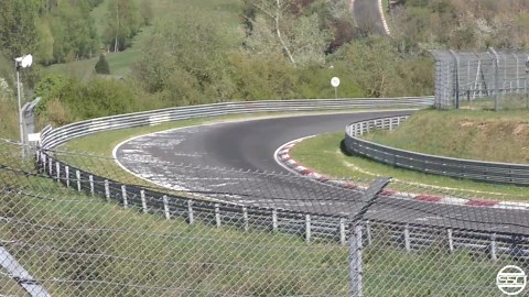 Camouflaged BMW prototype pushes limits on Nürburgring corner