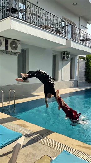Playful Martial Arts Pool Acrobatics with Father and Son