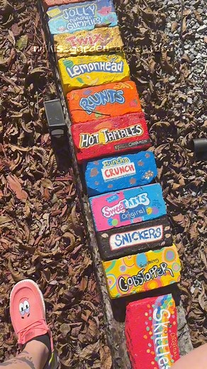 Mini brick tour I have around 60 of these 🤯 such fun garden decor and there’s a ton of variety #brickart #gardendecor #candyland | Nikki Adams