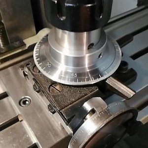 Making parts that improve that little divider: => degree graduation ring and the base plate as well as the ER32 top The divider is from an Astoba KWM but can be used on other small machines as well. | Swisstoolmaker