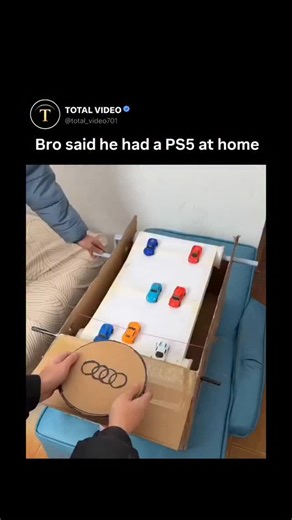 TOTAL VIDEO on Instagram: "Dm for credit removal The video captures a creative "homemade racing simulator" featuring a cardboard steering wheel and a manual treadmill-style track made of paper and rolling pins. A person maneuvers a small toy car through an obstacle course of other cars by physically rotating a cardboard Audi-branded wheel, showcasing an ingenious DIY alternative to expensive gaming consoles. Posted by @ NoContextHumans on January 19, 2026, this clip is a repost of a trending "li