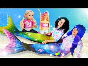 The princesses prepare a magic potion, turn into mermaids, and have fun with their dolls.