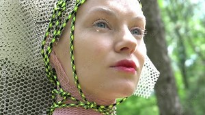 Slow Motion A girl tied to a tree in a forest. Fantasy.