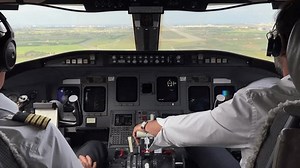 Jet cabin inside view during a real landing at the runway after a bumpy final approach.