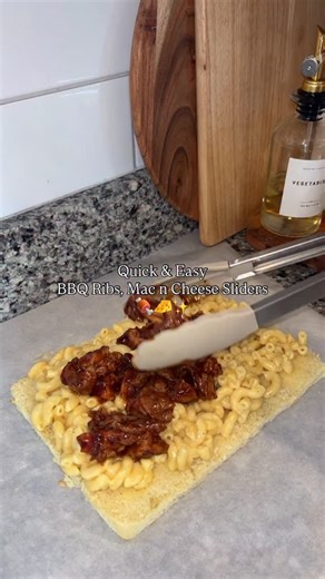 @jallyssa_michelle on Instagram: "Sliders are one of those foods that feel special without being complicated. And when you stuff them with mac & cheese and shredded BBQ ribs it’s top tier! Here’s my step-by-step: 1. Slice your slider buns in half. 2. Mix up garlic butter and brush it onto the cut sides. Toast until golden. 3. Add a layer of mac & cheese. 4. Pile on saucy shredded BBQ ribs. The mix of smoky + cheesy is unreal. 5. Add the top buns and brush with more garlic butter, add a little pa