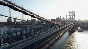 Aerial footage of the Philadelphia Skyline with the Benjamin Franklin Bridge and the Delaware River in the background.