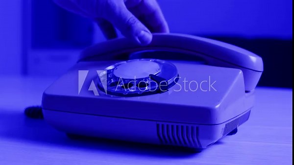 Retro vintage phone, A yellow rotary telephone is displayed on a wooden desk, adding a nostalgic touch