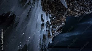 Rotating star sky at night. View through ice cave.