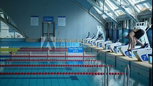 woman swimming in indoor swimming pool