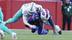 Jaelan Phillips greets James Cook upon RB's receipt of handoff for 5-yard TFL