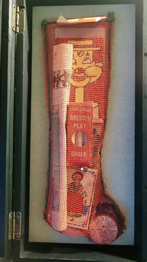 Eva on Instagram: "I’ve been collecting vintage and antique Christmas for years, and this is my holy grail: a fully intact pre-WWII Christmas stocking, usually handed out by churches and charities, or sold at five and dimes. For many children during the depression, this would be their only gift. From the red cotton mesh to the paper toys and metal bank, every detail reflects documented materials and manufacturing styles of the early 1930s. This isn’t just festive—it’s historical. I've spent year