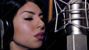 Portrait close up of the singer.Recording in the studio singers.