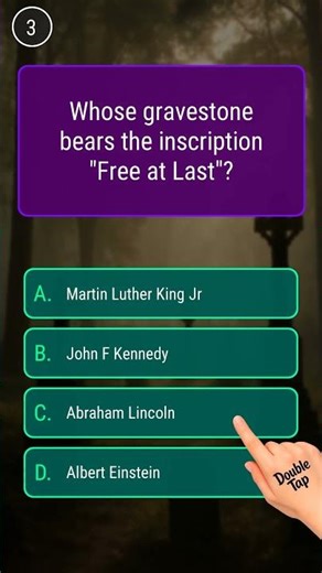 Whose gravestone bears the inscription "Free at Last"?