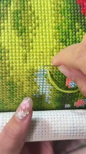 This is sewing art using wool thread following pattern on paper to create beautiful handmade design