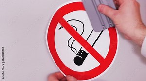 No smoking sign. Installation of vinyl stickers. Combating outdoor smoking in public places