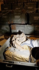Found an abandoned military bunker with 30-40 wooden crates stacked to the ceiling. Every crate is marked "AMMUNITION - EXPLOSIVES - HANDLE WITH CARE" with military warnings. Opened one crate expecting to find bullets. Instead, it was filled with gold bars wrapped in oiled paper from 1945. Someone disguised a fortune in gold as ammunition to hide it. How many more crates contain gold instead of explosives? Would you open them all or report this? #treasure #military #bunker #gold #mystery #abando