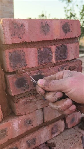 Use iron wire to scrape off the excess concrete.
