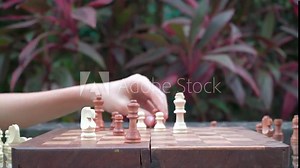 Two champions are playing the chess in the cafe