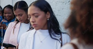 Waiting, recruitment and business women in line for hiring, career opportunity and interview. Group, hr queue and professional people job hunting, onboarding and technology by wall in city outdoor