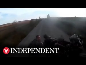 Moment armoured vehicle carrying fleeing Russian soldiers flips over on road