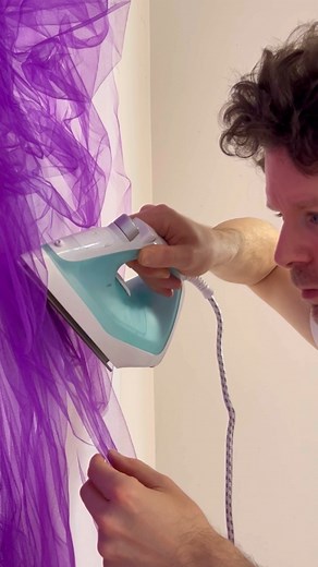 Arts Promote 🎨 on Instagram: "Benjamin Shine is a British artist who creates mesmerizing artworks using tulle fabric and an iron. His unique technique involves folding, pleating, and pressing the delicate tulle to form intricate portraits and sculptures, where the fabric’s transparency adds depth and texture. This innovative approach has led to his work being featured in prestigious institutions like the Metropolitan Museum of Art and the London Design Museum. Shine’s creations explore themes o