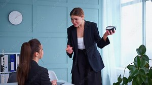 Boss screaming at frustrated employee, showing clock bullying and emotional abuse at work. Toxic work environment. Angry female irate boss yelling and shouting at his secretary employee. late for work
