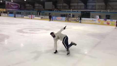 Guy in Mask Does Ice Skating Freestyle
