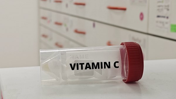 VITAMIN C plastic box of tablets on hospital pharmacy shelf; clean clinical setting, labeled container, front-facing view emphasizing immune support and supplement use Stock Video Footage - Alamy