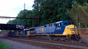 A diverse trio of CSX engines lead a westbound company freight train through Woodbourne, Pennsylvania on a fine summer evening. ➡️ Follow Trainiac Productions for more original train content! #trainiac #railfan #trainspotting #trains #railways #CSX #freighttrain #railroad #railway #train #pennsylvania #fyp | Trainiac Productions