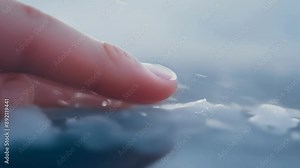 A visible wince as the frigid surface makes contact with the palm followed by a swift pull back of the hand.