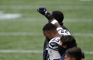 All 22 Seahawks and Falcons players take a knee during the opening kickoff to protest racial injustice
